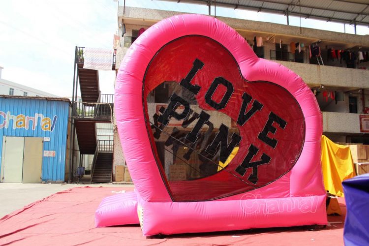 pink love themed bouncy castle for wedding